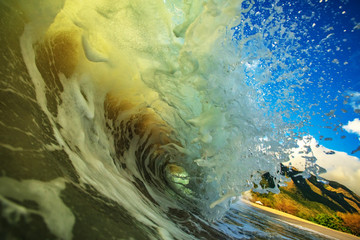 Wall Mural - ocean splashed wave in rip curl shape. surfing sport activity in tropical water