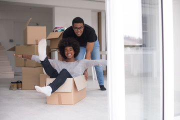 Wall Mural - African American couple  playing with packing material