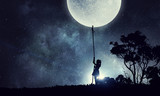 Fototapeta Na sufit - Kid girl catching moon