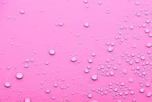 Water Drops On A Pink Background