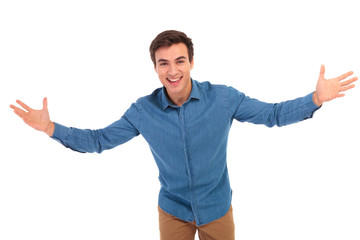 Wall Mural - excited young casual man welcoming