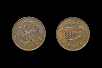 An Irish coin of two pence from 1988 isolated on black background.