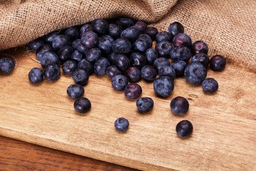 Sticker - Split blueberries on a rustic wooden background