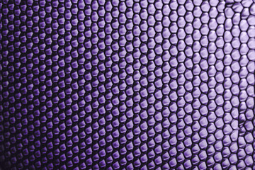 abstract texture honeycomb. Metallic net background or texture. metal mesh. full frame colourful illuminated detail of a metallic grid in front of a loudspeaker. Colorful abstract background.