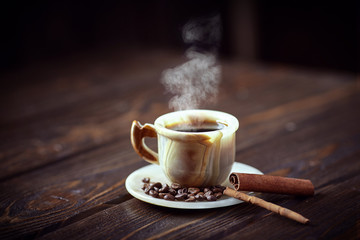 Strong coffee on the wooden background. Fresh coffee.