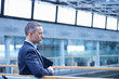© Connect Images - Businessman waiting on office balcony