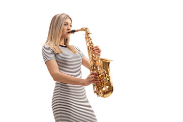 Canvas Print - Young woman in a striped dress playing a saxophone