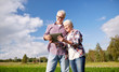 © Syda Productions - happy senior couple with tablet pc at summer farm