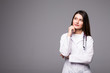 © F8  \ Suport Ukraine - Thoughtful, Young female doctor looking away isolated on grey background