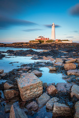 Sticker - St Mary's Lighthouse in portrait / St Mary's Lighthouse on a small rocky Island, just north of Whitley Bay on the North East coast of England. A causeway submerged at high tide links to the mainland