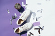 © pidphoto - Beauty blog concept. Flat lay feminini white keds on white background. White sneakers.