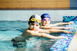© Iryna - Two happy children ready to start workout in swim pool.