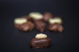 Fototapeta Big Ben - Delicious chocolate truffles pralines on a black background image.