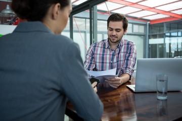 Wall Mural - Business executive conducting job interview with woman