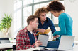 © Kzenon - Three involved students sharing ideas and opinions about different topics at the university