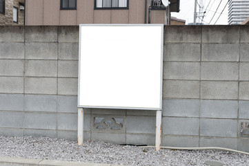 Large blank billboard on a street wall, banners with room to add your own text