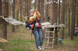 © makam1969 - Gomel, Belarus - 30 April, 2017: Rope town for a family holiday in the countryside. Family competition to overcome aerial obstacles.