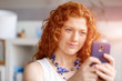 © Sergey Nivens - Happy beautiful young businesswoman using smart phone smiling