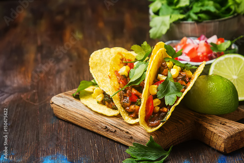 Fotografie, Obraz Traditional Mexican tacos with tomatoes, meat, herbs