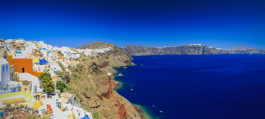 Sticker - Picturesque view of Old Town Oia on the island Santorini, white houses, windmills and church with blue domes, Greece