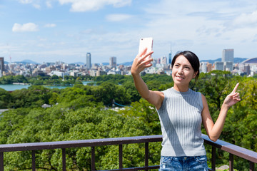 Canvas Print - Woman travel in fukuoka and takeing selfie