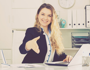 Portrait of young smiling girl in the office