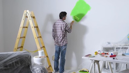 Wall Mural - Man painting interior walls at home