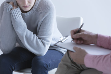 Girl during session with psychotherapist