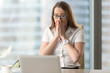 © fizkes - Surprised businesswoman looking at laptop screen. Pretty girl suddenly puzzled with e-mail or news in Internet. Young female office worker looks shocked after computers critical failure
