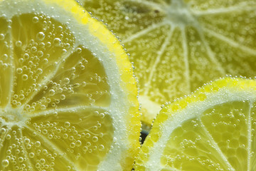 Lemon under water in air bubbles