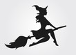 Silhouette of a witch flying on a broomstick