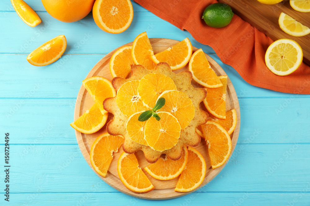 Delicious citrus cake on wooden table