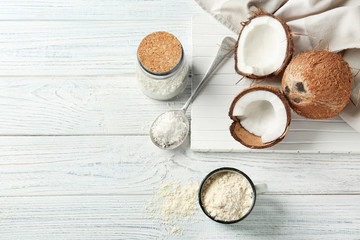 Wall Mural - Composition with coconut flour on wooden background