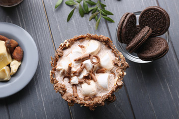 Wall Mural - Composition with tasty cocoa drink on wooden table