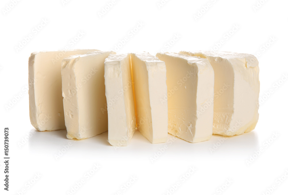 Delicious butter pieces on white background, closeup