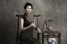 Retro Styled Portrait Of Elegant Woman Wearing A Qipao