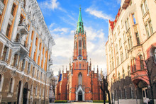 Church Of St. Gertrude On The Streets Of Riga, Latvia On A Sunny Day