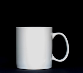 White mug on the black background