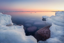 Scenic Seascape With Sunset And Nice Stones Under The Water At Winter Time In Finland