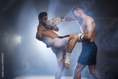 Leinwand Poster Two boxers athletes training in the gym