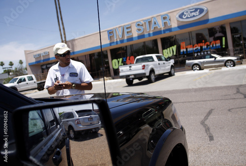 A Ford Edge Is Reflected In Mirror As Lot Attendant Charlie Long A Ford Edge Is Reflected In Mirror As Lot Attendant Charlie Long Looks Over Vehicles