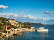 Catamaran Docked In A Bay With Restaurant In Croatia At Sunset, Kaprije Island