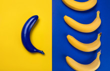 Top View Of Fresh Ripe Yellow Bananas And Blue One Isolated On Blue And Yellow