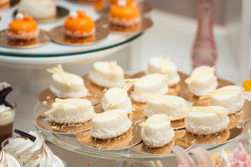 Wall Mural - glass stand with cupcakes on a wedding candy bar table