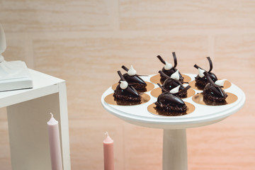 Wall Mural - Dessert - Chocolate pastry on a white stand