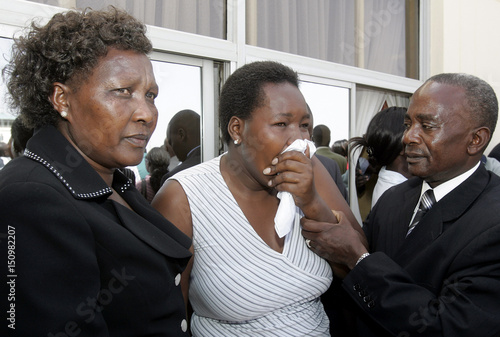 Relatives And Friends Cry As The Bodies Of Kenyan Cabinet Minister