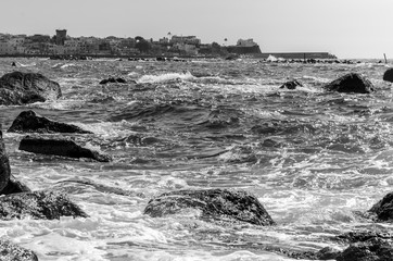 Wall Mural - The waves crash on the cliff of Forio in Ischia