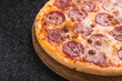 © dimasobko - Closeup of hot pizza with salami sausage