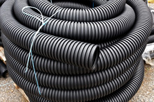 Coiled And Stacked Drainage Tubing.