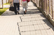 © anetlanda - Couple man and woman walking with sport bags.
